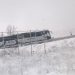 Autobús atascado por la nieve en la pasarela de Villabalter